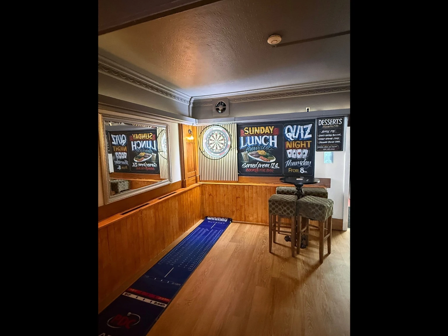 Darts and games area inside the Robin Hood